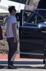 ELISABETH MOSS Gets a Hug from Max Minghella Following Her Pregnancy Announcement in Los Angeles 01/31/2024