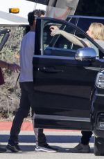 ELISABETH MOSS Gets a Hug from Max Minghella Following Her Pregnancy Announcement in Los Angeles 01/31/2024