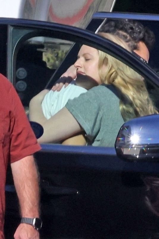 ELISABETH MOSS Gets a Hug from Max Minghella Following Her Pregnancy Announcement in Los Angeles 01/31/2024
