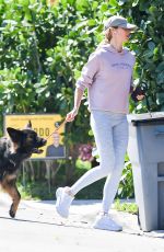 GISELE BUNDCHEN on a Dog Walk in Miami 02/21/2024