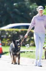 GISELE BUNDCHEN on a Dog Walk in Miami 02/21/2024