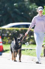 GISELE BUNDCHEN on a Dog Walk in Miami 02/21/2024