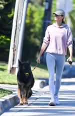 GISELE BUNDCHEN on a Dog Walk in Miami 02/21/2024