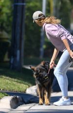 GISELE BUNDCHEN on a Dog Walk in Miami 02/21/2024