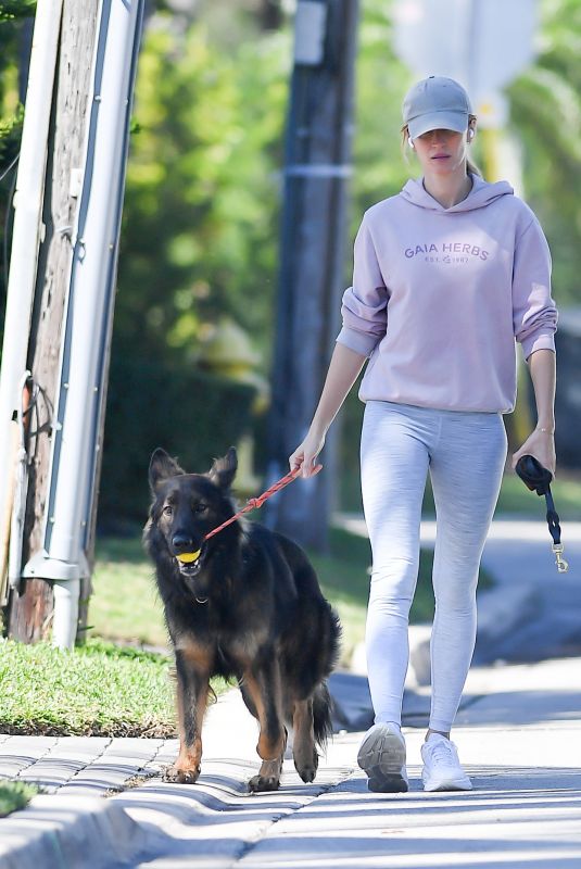 GISELE BUNDCHEN on a Dog Walk in Miami 02/21/2024
