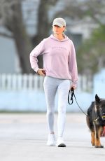 GISELE BUNDCHEN on a Dog Walk in Miami Beach 02/23/2024