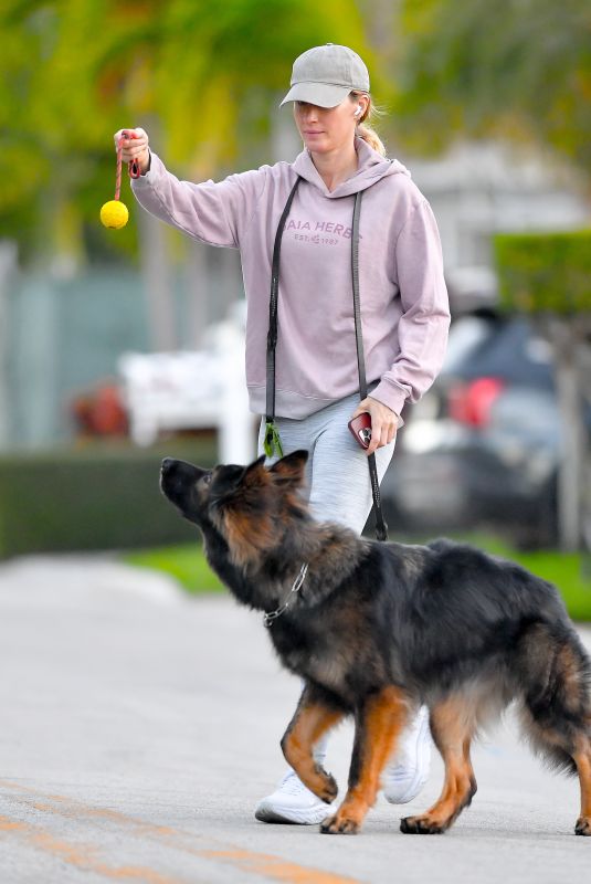 GISELE BUNDCHEN on a Dog Walk in Miami Beach 02/23/2024