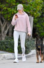 GISELE BUNDCHEN on a Dog Walk in Miami Beach 02/23/2024
