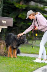 GISELE BUNDCHEN on a Dog Walk in Miami Beach 02/23/2024