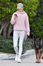 GISELE BUNDCHEN on a Dog Walk in Miami Beach 02/23/2024