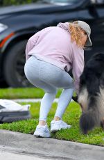 GISELE BUNDCHEN on a Dog Walk in Miami Beach 02/23/2024