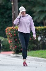 GISELE BUNDCHEN Out with Her Dog in Miami 02/02/2024