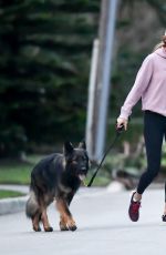 GISELE BUNDCHEN Out with Her Dog in Miami 02/02/2024