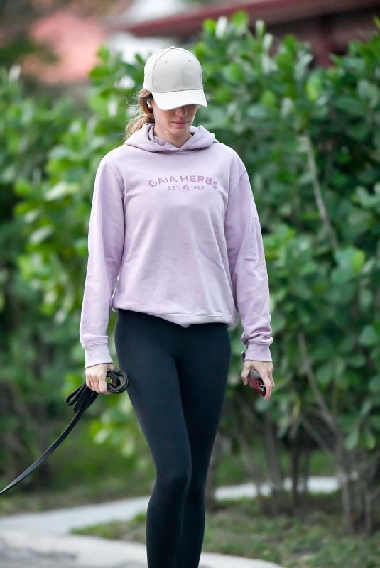 GISELE BUNDCHEN Out with Her Dog in Miami 02/02/2024
