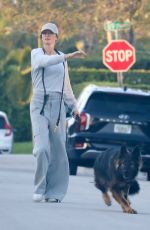 GISELE BUNDCHEN Out with Her Dog in Miami Beach 02/12/2024