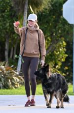 GISELE BUNDCHEN Out with Her German Shepherd in Surfside 02/22/2024