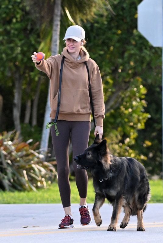 GISELE BUNDCHEN Out with Her German Shepherd in Surfside 02/22/2024