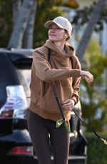 GISELE BUNDCHEN Out with Her German Shepherd in Surfside 02/22/2024