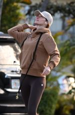 GISELE BUNDCHEN Out with Her German Shepherd in Surfside 02/22/2024