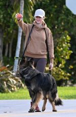 GISELE BUNDCHEN Out with Her German Shepherd in Surfside 02/22/2024