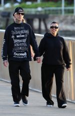 KOURTNEY KARDASHIAN and Travis Barker Out at Brisbane River 02/18/2024