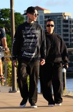KOURTNEY KARDASHIAN and Travis Barker Out at Brisbane River 02/18/2024