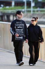 KOURTNEY KARDASHIAN and Travis Barker Out at Brisbane River 02/18/2024