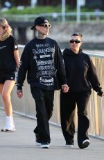 KOURTNEY KARDASHIAN and Travis Barker Out at Brisbane River 02/18/2024