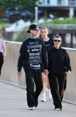 KOURTNEY KARDASHIAN and Travis Barker Out at Brisbane River 02/18/2024