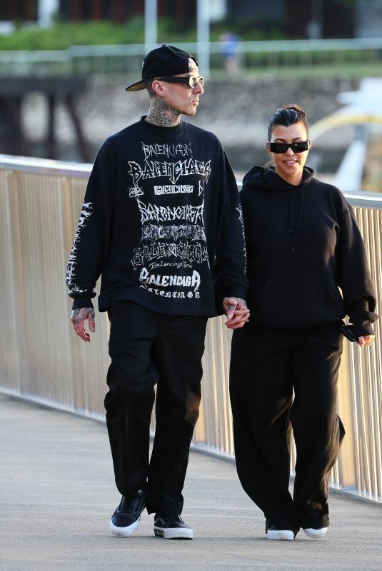 KOURTNEY KARDASHIAN and Travis Barker Out at Brisbane River 02/18/2024