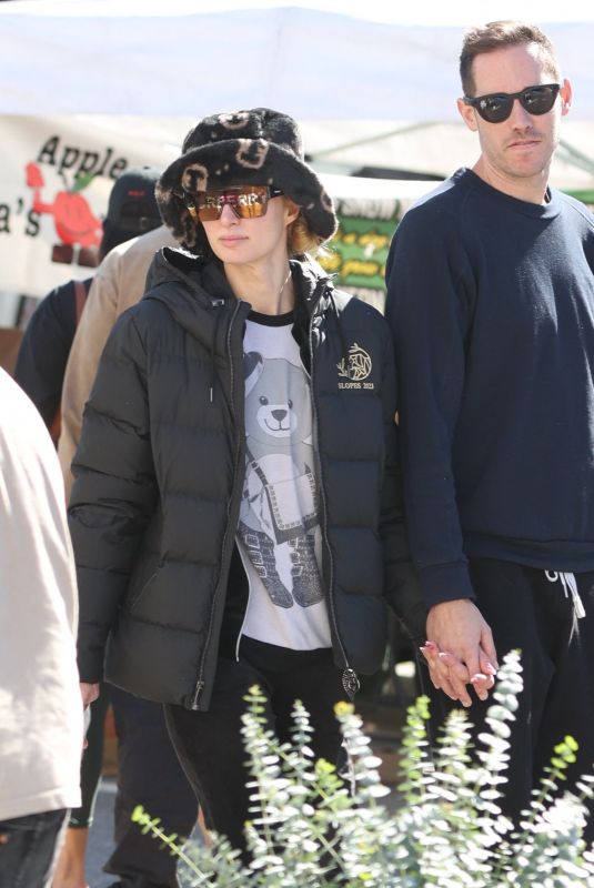 PARIS HILTON and Carter Reum Shopping at a Farmers Market in Los Angeles 02/11/2024