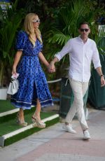 PARIS HILTON and Carter Reum Takes a Stroll on Miami Beach Boardwalk 02/01/2024