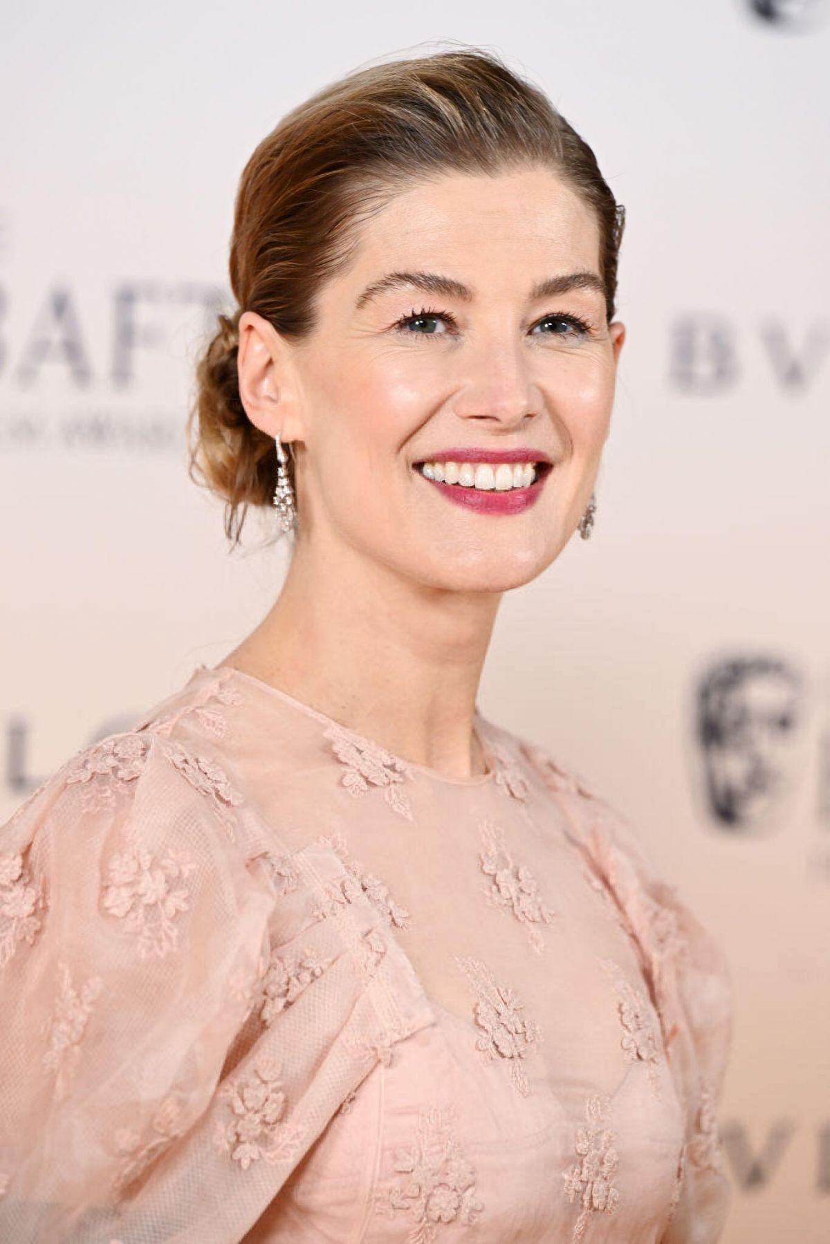 ROSAMUND PIKE at EE Bafta Film Awards 2024 Nominees Party in London 02