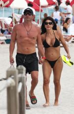 TERESA GIUDICE in Bikini and Luis Ruelas at a Beach in Miami 02/18/2024