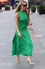 AMANDA HOLDEN in a Bright Green Dress Arrives at Heart Radio in London 03/20/2024