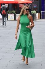 AMANDA HOLDEN in a Bright Green Dress Arrives at Heart Radio in London 03/20/2024