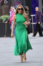 AMANDA HOLDEN in a Bright Green Dress Arrives at Heart Radio in London 03/20/2024