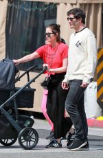 ASHLEY BENSON and Brandon Davis Out with Their Baby at Il Pastaio in Beverly Hills 03/27/2024