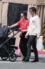ASHLEY BENSON and Brandon Davis Out with Their Baby at Il Pastaio in Beverly Hills 03/27/2024