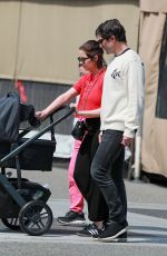 ASHLEY BENSON and Brandon Davis Out with Their Baby at Il Pastaio in Beverly Hills 03/27/2024