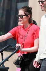ASHLEY BENSON and Brandon Davis Out with Their Baby at Il Pastaio in Beverly Hills 03/27/2024
