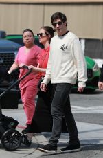 ASHLEY BENSON and Brandon Davis Out with Their Baby at Il Pastaio in Beverly Hills 03/27/2024