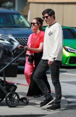 ASHLEY BENSON and Brandon Davis Out with Their Baby at Il Pastaio in Beverly Hills 03/27/2024