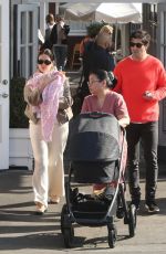 ASHLEY BENSON and Brandon Davis Out with Their Baby in Brentwood 03/04/2024