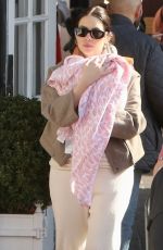 ASHLEY BENSON and Brandon Davis Out with Their Baby in Brentwood 03/04/2024