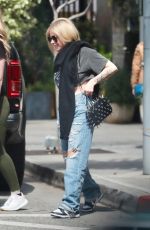 AVRIL LAVIGNE in Ripped Denim Out Shopping in Beverly Hills 03/15/2024