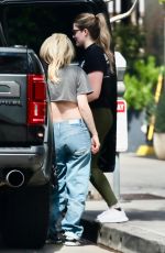 AVRIL LAVIGNE in Ripped Denim Out Shopping in Beverly Hills 03/15/2024