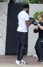 BEBE REXHA Shows off Her Boxing Skills with a Trainer in Los Angeles 03/16/2024
