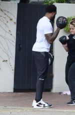BEBE REXHA Shows off Her Boxing Skills with a Trainer in Los Angeles 03/16/2024