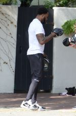 BEBE REXHA Shows off Her Boxing Skills with a Trainer in Los Angeles 03/16/2024